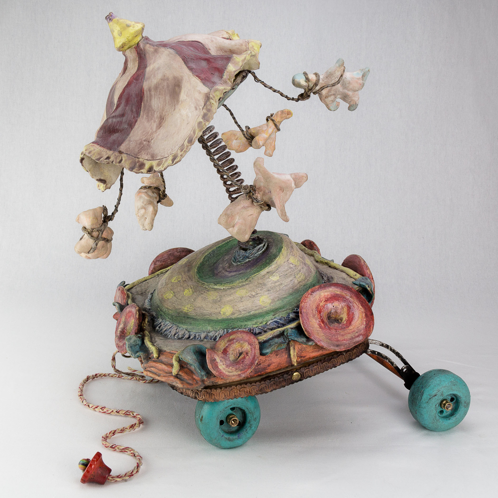 Gina M.  Suspension of Disbelief from the Lost, Not Forgotten Series, 2016  high-fired ceramic, spring, toy wheels, encaustic paint  18 x 18 x 24”  Courtesy of the artist