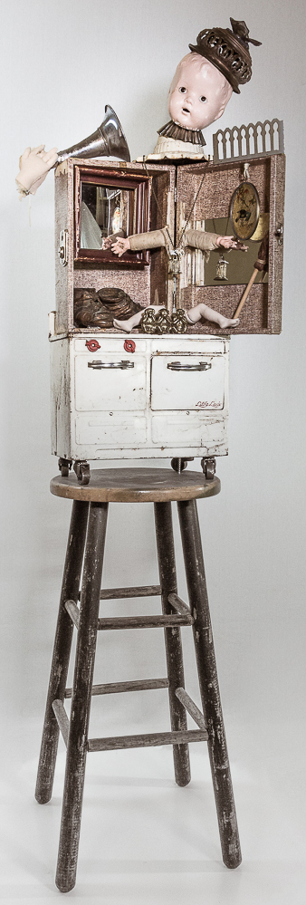 Gina M.  Listen Little Lady from the Toy Box Kids Series, 2018  assemblage, toy stove, man hands, doll parts, stool, mirrors, bronze baby shoes  61 x 24 x 16”  Courtesy of the artist