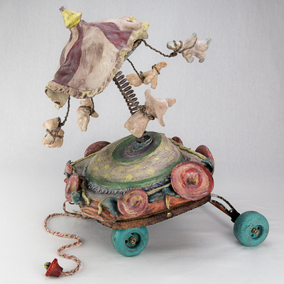 Gina M.  Suspension of Disbelief from the Lost, Not Forgotten Series, 2016  high-fired ceramic, spring, toy wheels, encaustic paint  18 x 18 x 24”  Courtesy of the artist