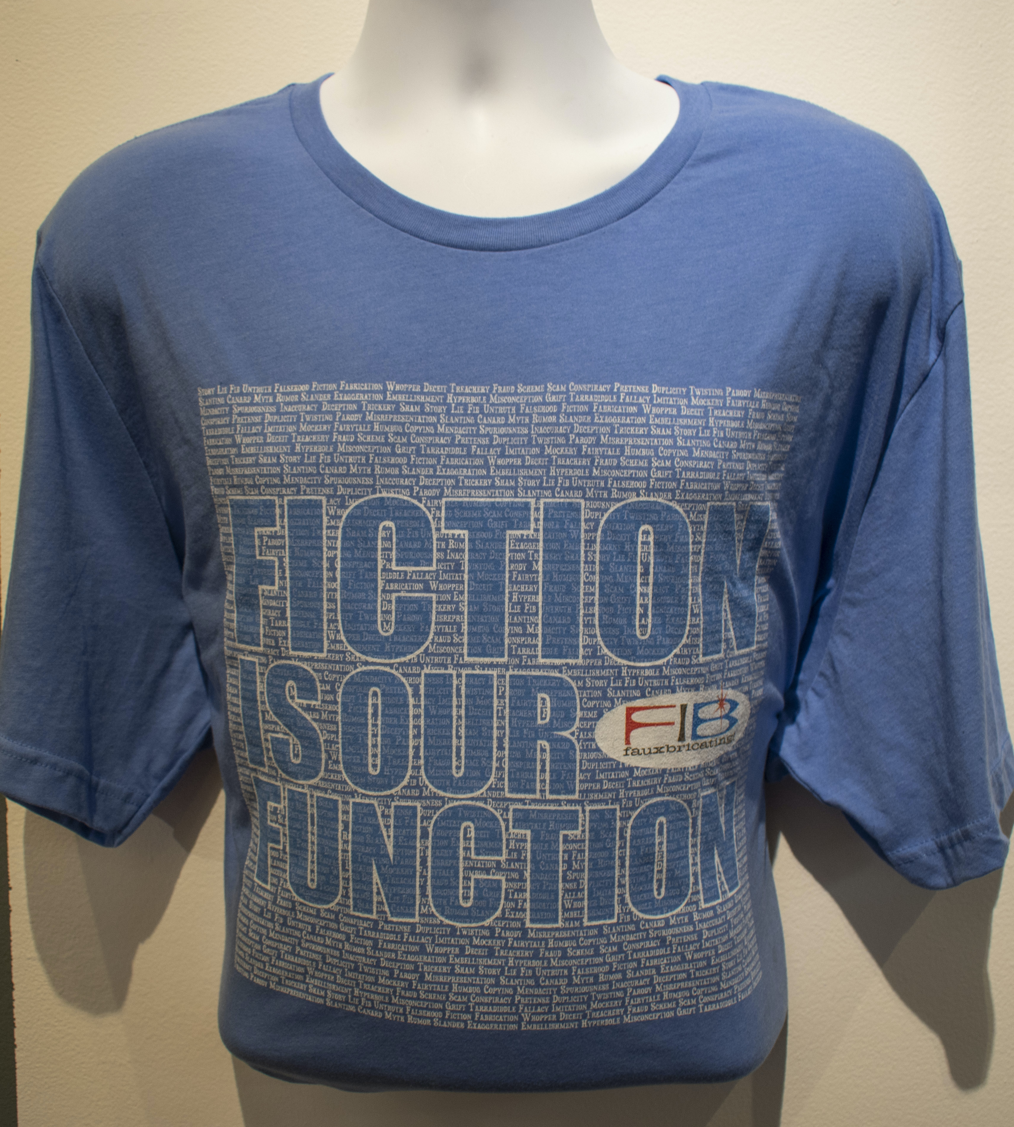 A sapphire blue t-shirt with white text on it that says Fiction is our Function. 