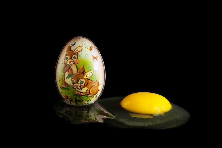 decorative egg next to raw egg