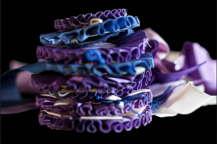 pile of purple and blue ribbons 