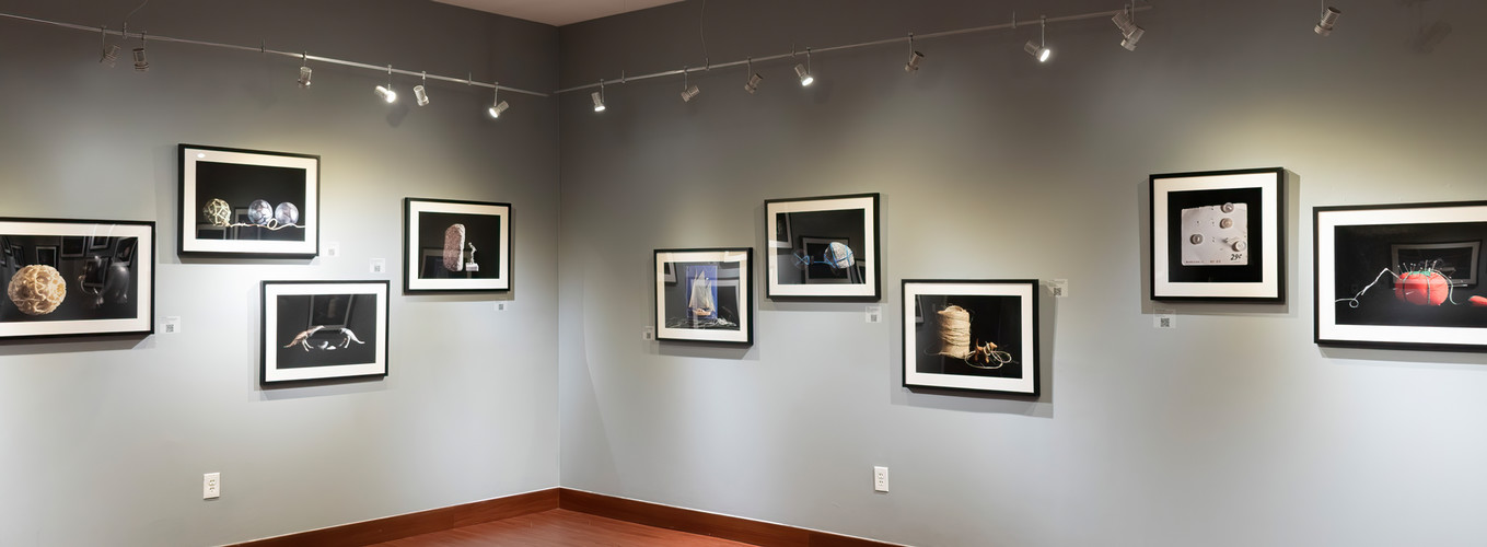 installation view of the corner with framed pictures of Jane szabo art work
