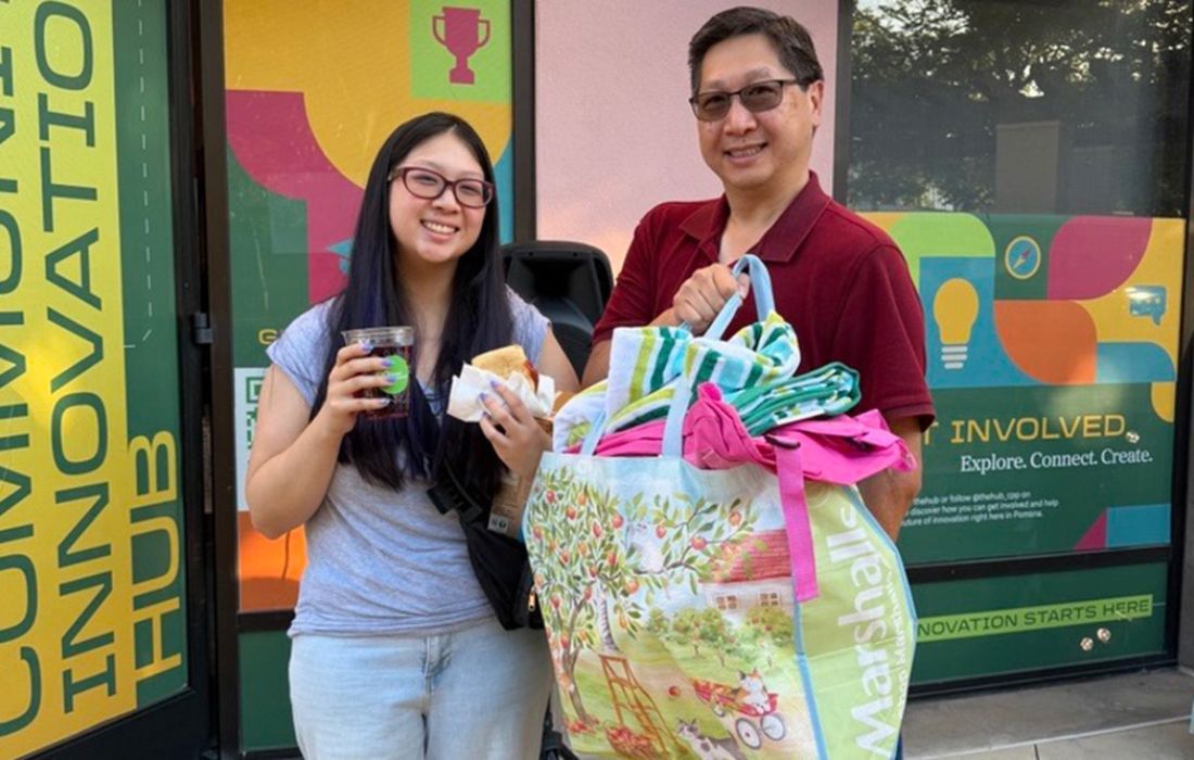 Two people holding supplies