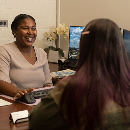 Academic Advisor Nicole Turner works with a student at the College of Agriculture 