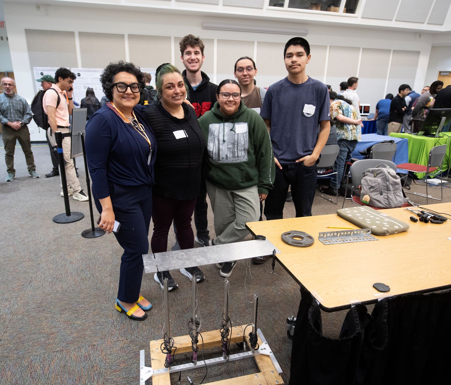 Students pose for a photo during an AI fair on campus.