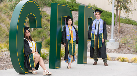 Anais Hernandez, Taz Alamillo and Rylan Braley pose at the CPP letters.
