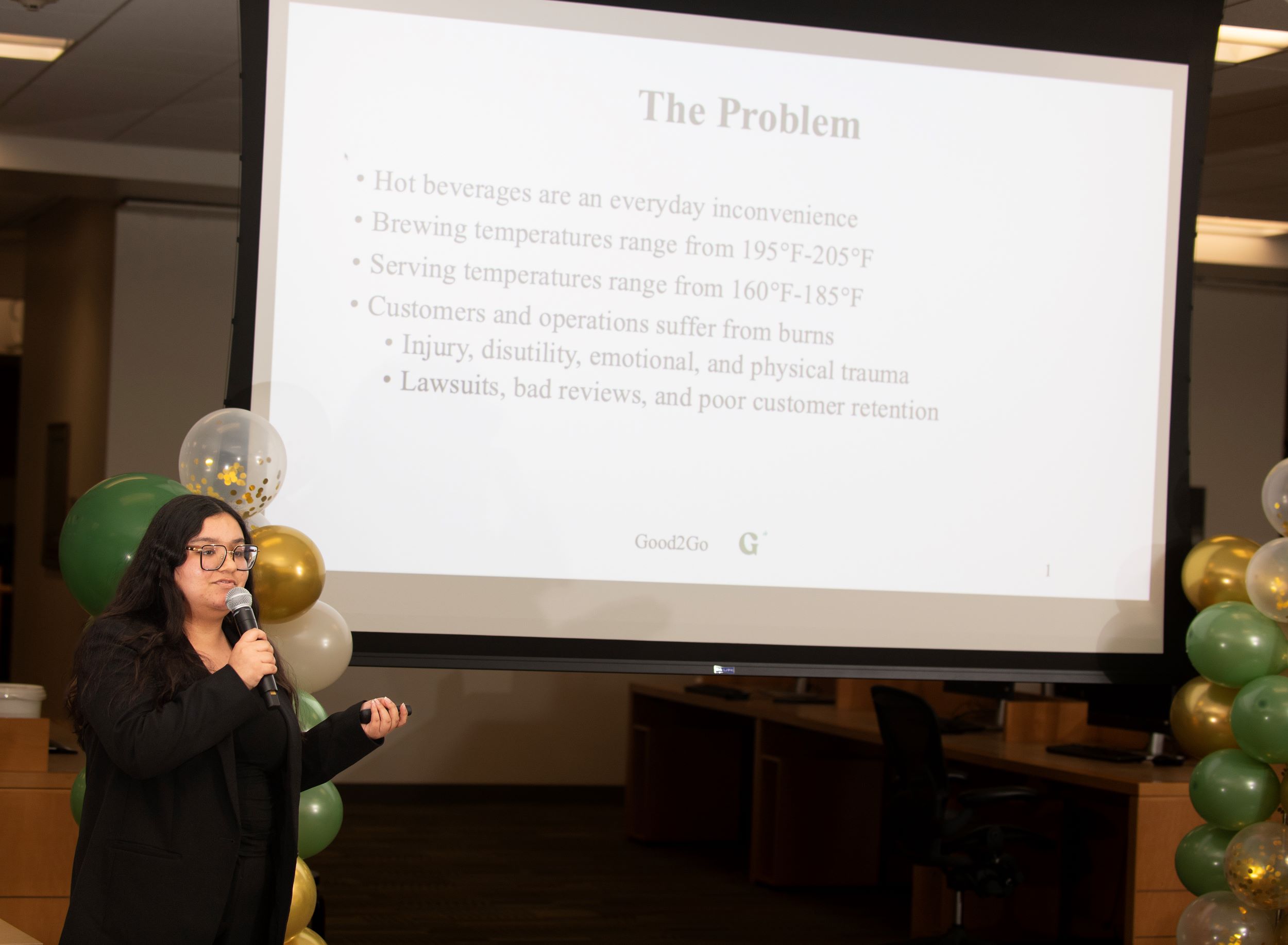 Female students speaks during a presentation during fast pitch competition