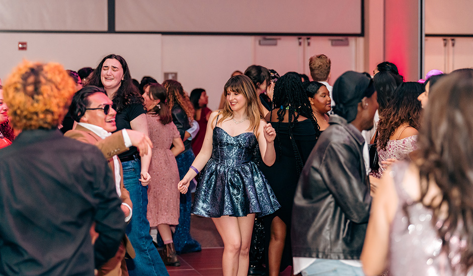 Female student dances wearing a metallic dress during the 2026 ASI Gala.