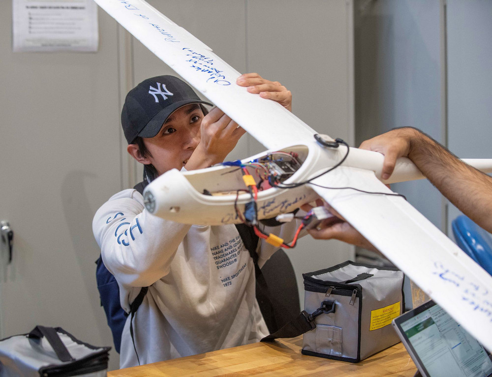 Student working with a plane prototype