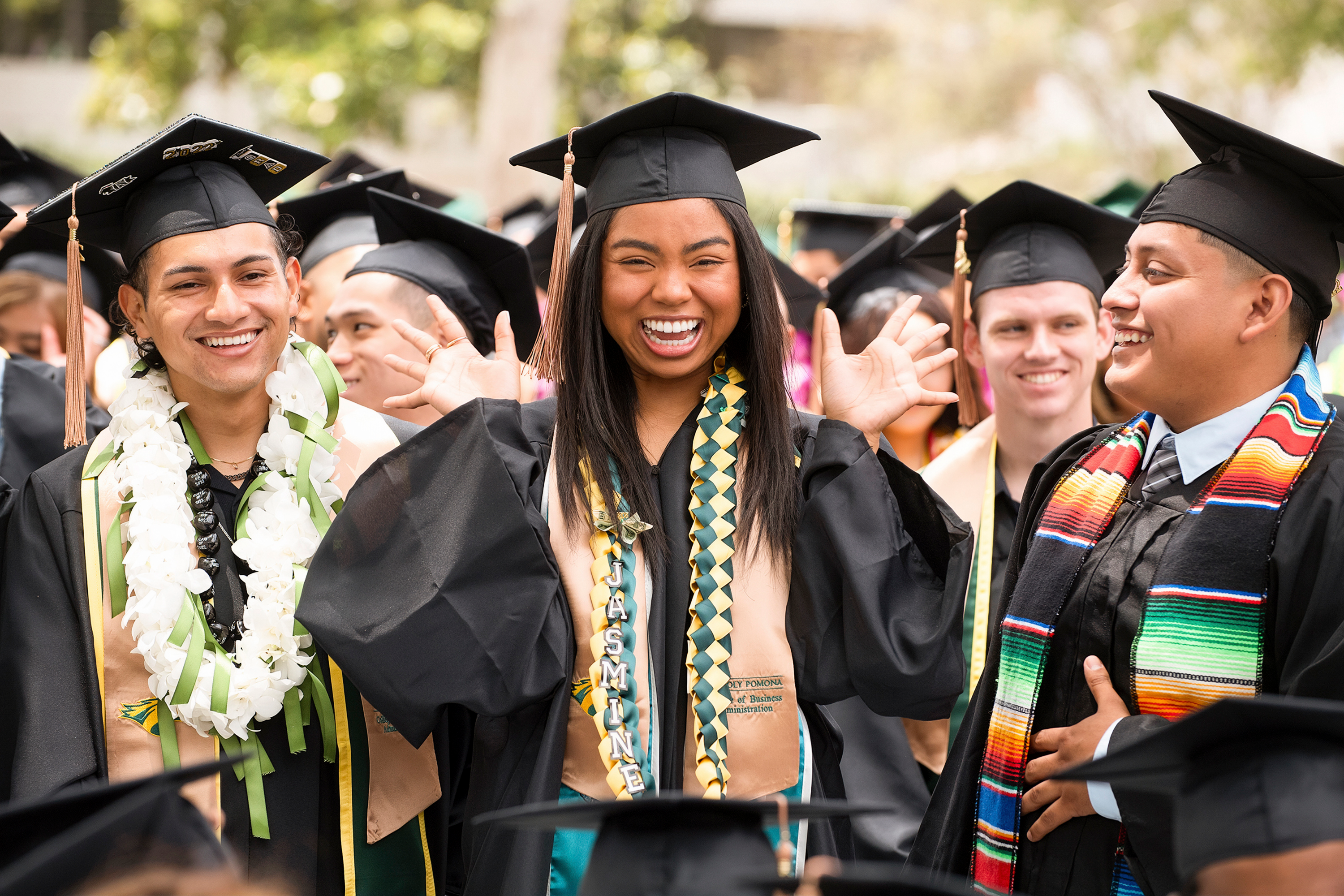Cheerful graduates at commencement ceremony