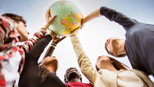 student holding globe