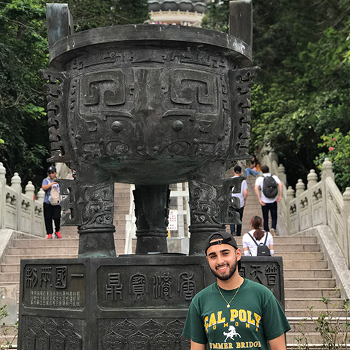 student next to statue