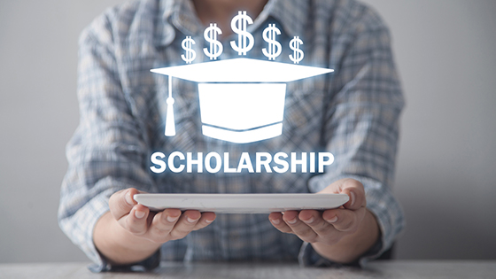 person holding scholarship 