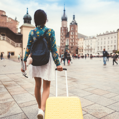 student walking with briefcase