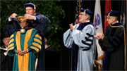 CSU Chancellor Timothy White places the presidential medallion around President Soraya M. Coley's neck.