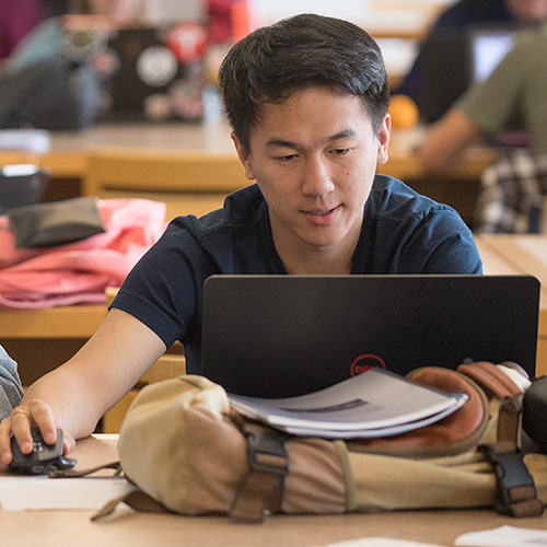 student studying on a laptop