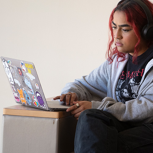 student working on a laptop