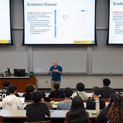 professor presenting in a large lecture hall