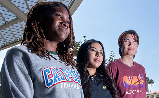 Three students looking onward