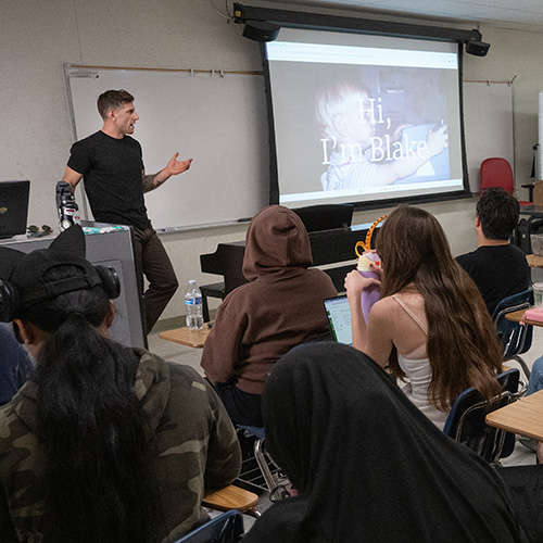 man presenting in a lecture hall