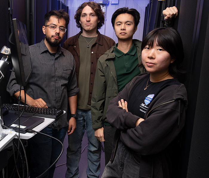 four students in a server room