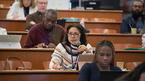 woman speaking in a lecture room