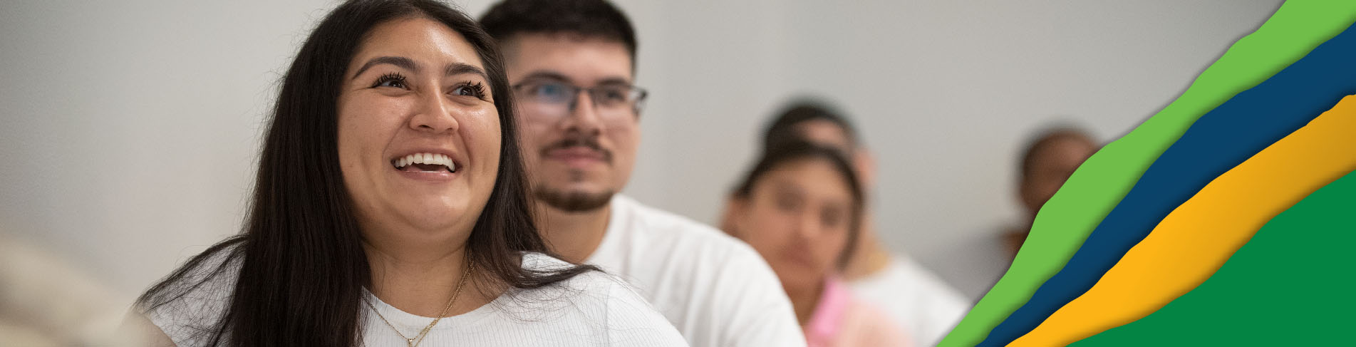 Cal Poly Pomona Students in a classroom smiling during a lecture