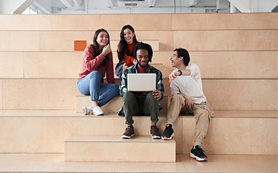 students working on laptop together