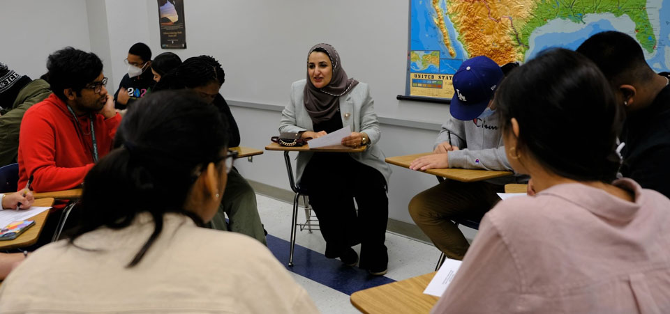group of students in a classroom having a discussion