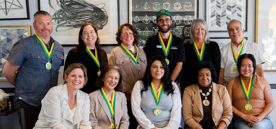 groups of faculty and staff receiving an award