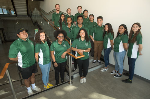 group of students standing on a staircase 