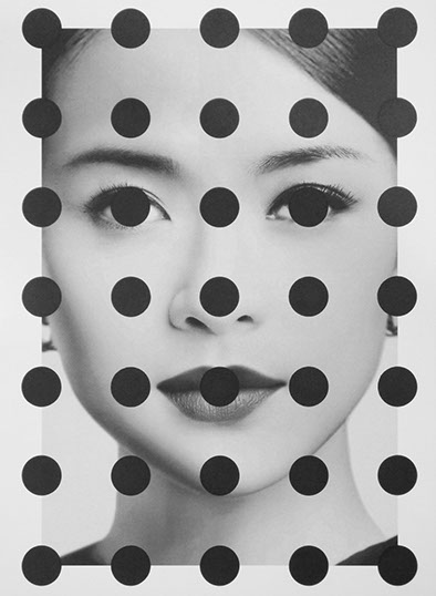 black and white portrait of an asian women staring directly towards the viewer. There is a pattern of black dots uniformly placed over the woman. Two dots cover her eyes and one dot sits directly in the center of her lips and another on her nose.