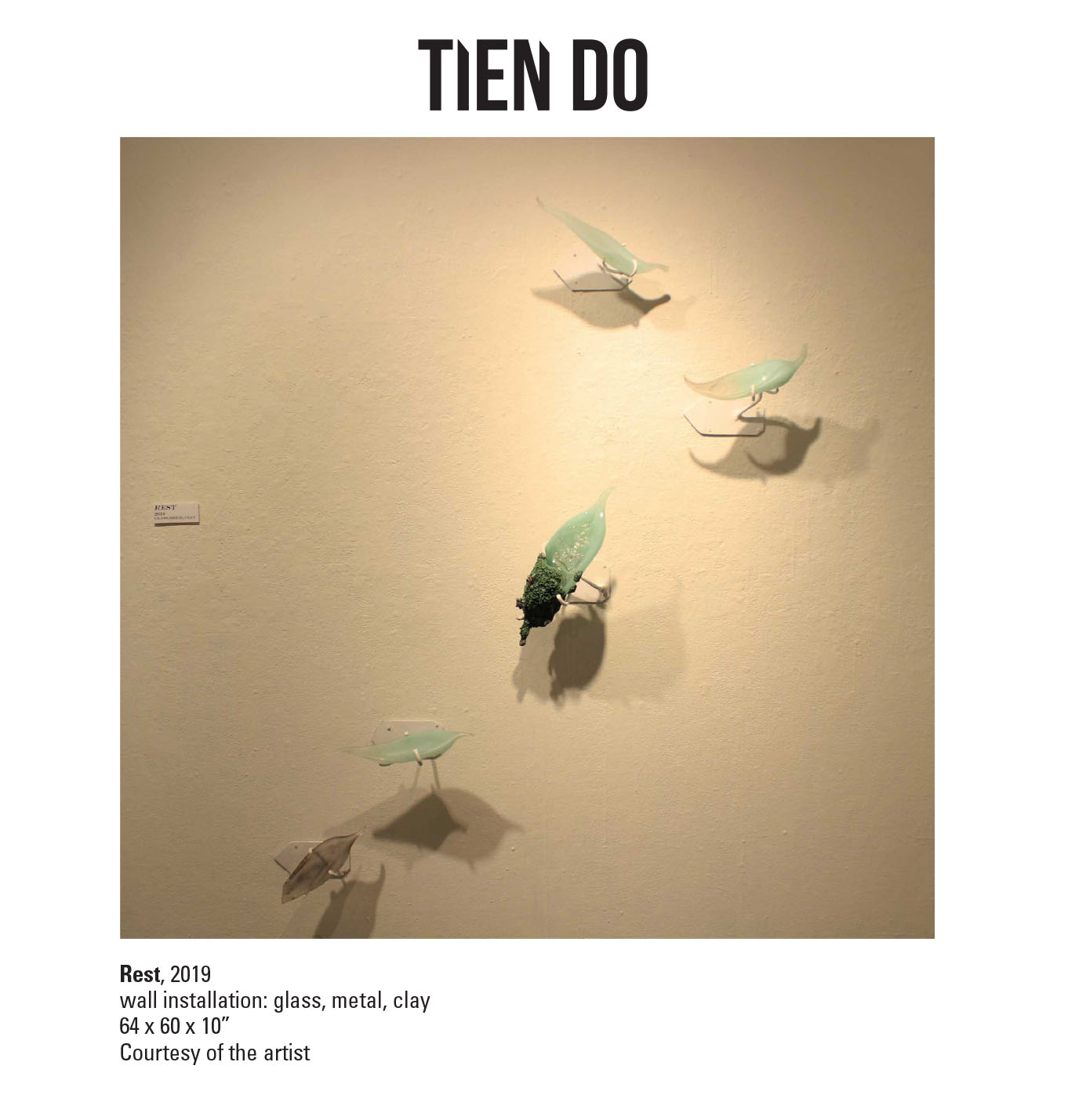 Tien Do, Rest, 2019. Wall installation: glass, metal, clay. 64 x 60 x 10” Courtesy of the artist. A series of glass leaves mounted onto a wall placed in a order that appears to be falling