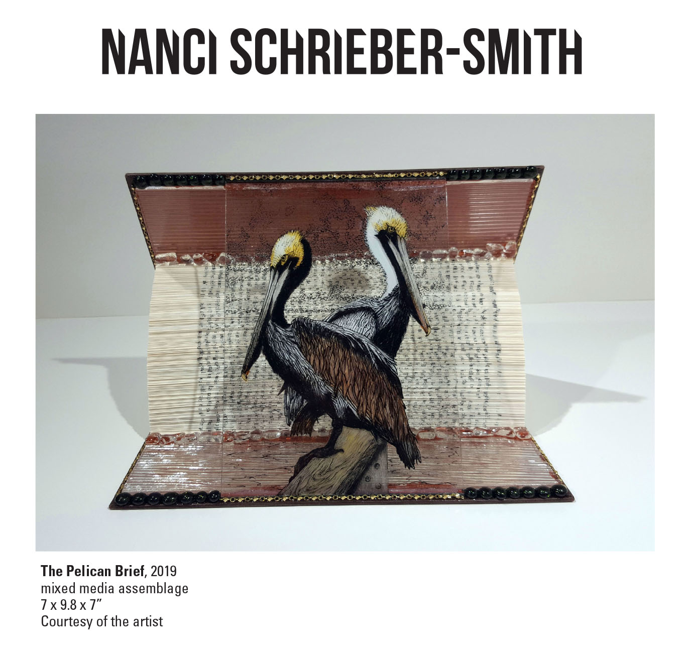 Nanci Schrieber-Smith, The Pelican Brief, 2019. Mixed media assemblage 7 x 9.8 x 7” Courtesy of the artist. A mixed media assemblage of two birds in front of a opened book. The Pelican Brief, 2019. Mixed media assemblage 7 x 9.8 x 7” Courtesy of the artist