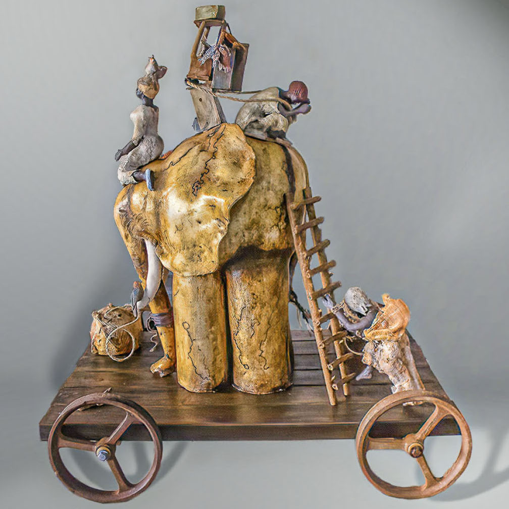 Nubia Bonilla, Wisdom and Loyalty, 2019. Hand-built coil, white clay, horse hair, wood, iron wheels. 38 x 32 x24" Courtesy of the artist. Human figures are crawling over an elephant on top of a cart