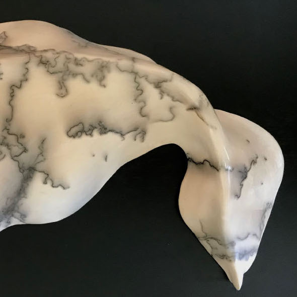 SJ Lane, Animate, 2019. Ceramic. 16 x 8 x 2.25” Courtesy of the artist. A sculpture of a organic looking form with messy black lines over white