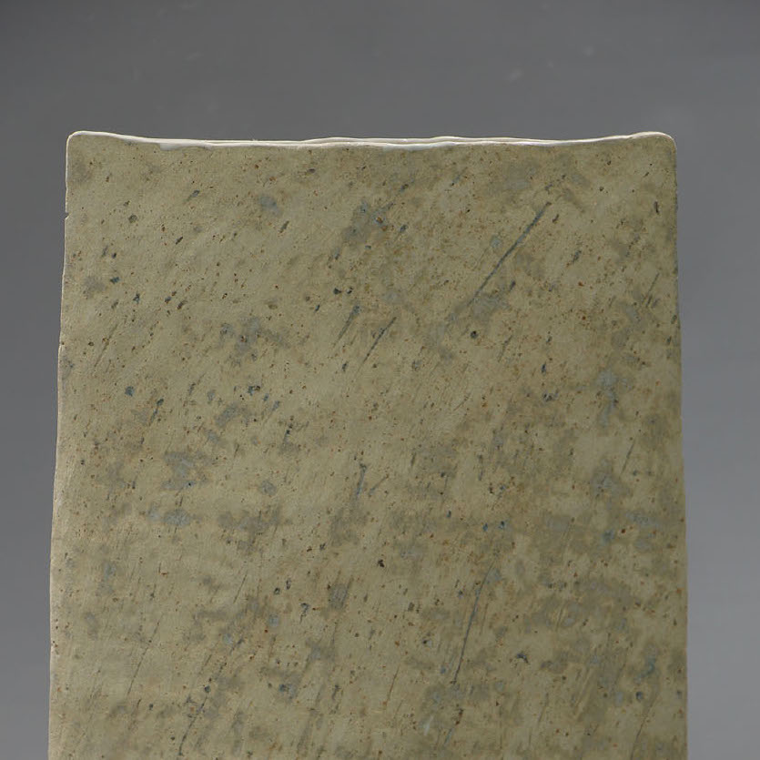 Ariane Leiter, Weathered Flat, 2018. Clay. 17 x 13.5 x 5.5” Courtesy of the artist. A sculpture of a rectangle shaped object that is tan in color
