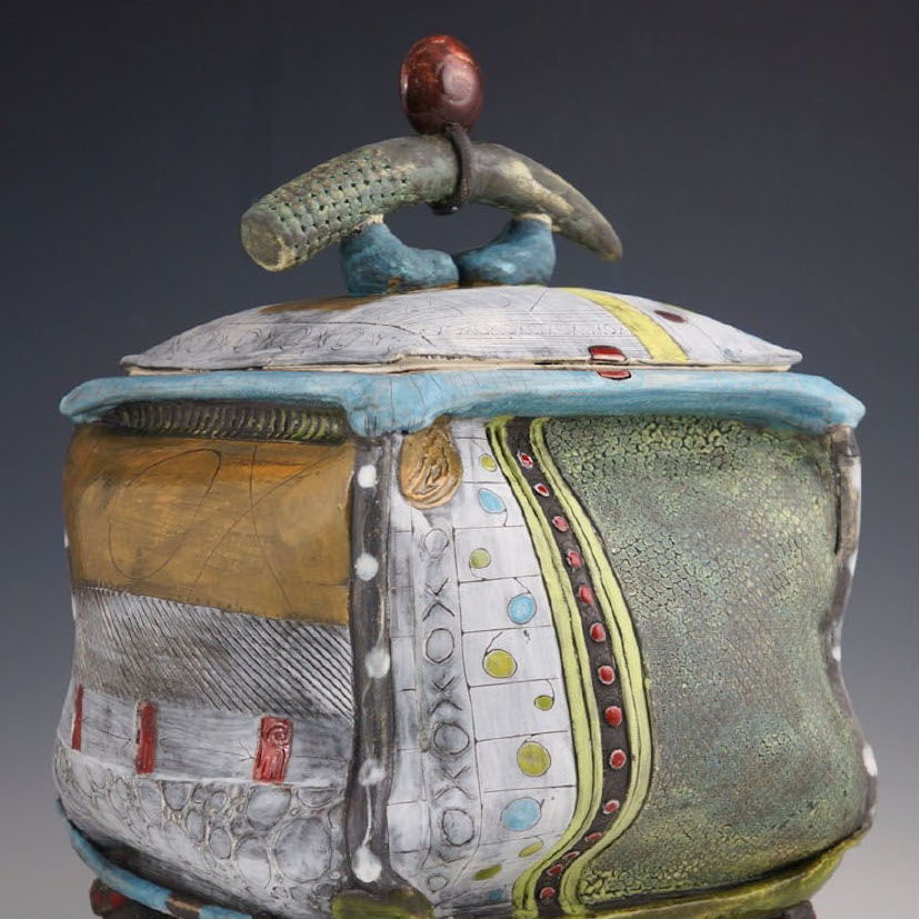 Daniel Oliver, Urn Series, 2019. Clay. 14 x 9 x 9” Courtesy of the artist. A sculpture of a urn with and handle on the top and warped side walls with patterns and buttons on the side