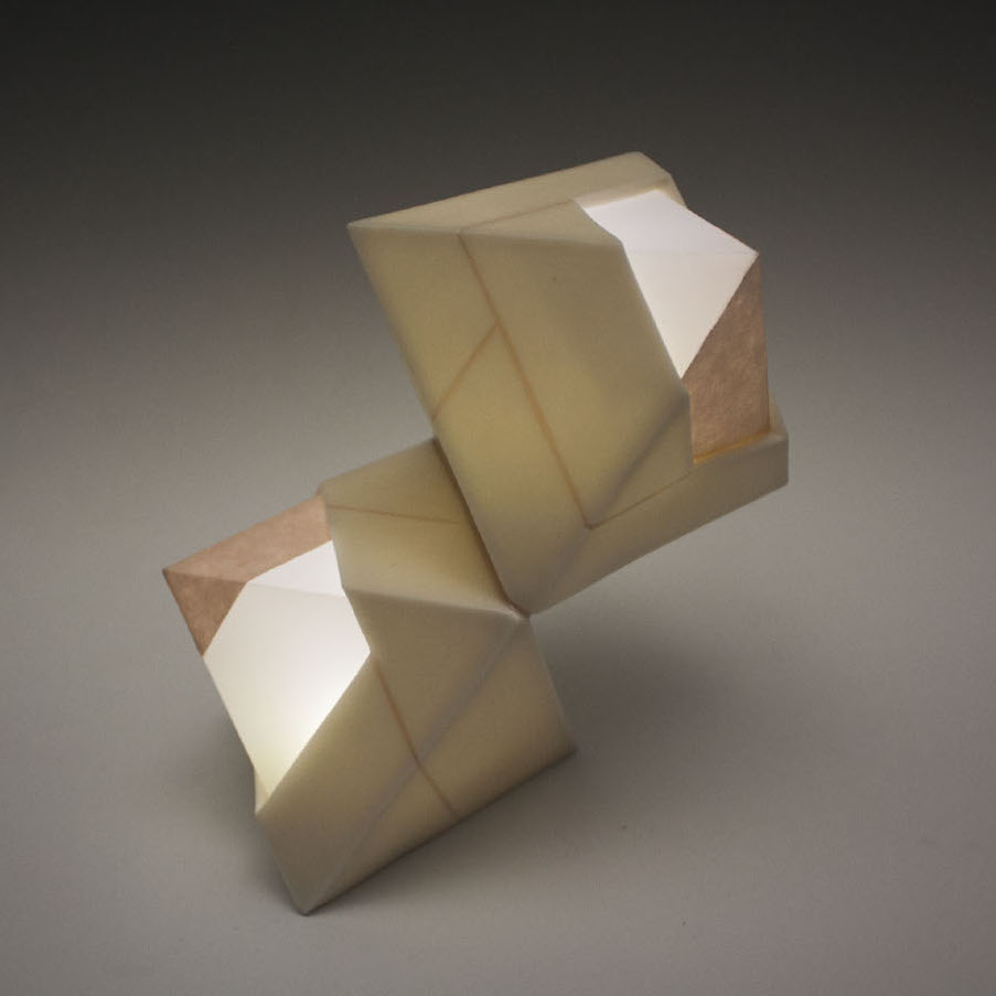 Ethan Snow, Formal Considerations, 2019. Porcelain, paper. 6 x 5 x 3" Courtesy of the artist. A sculpture of two geometrically shaped objects with different layers of colors. Ethan Snow, Formal Considerations, 2019. Porcelain, paper. 6 x 5 x 3" Courtesy of the artist.