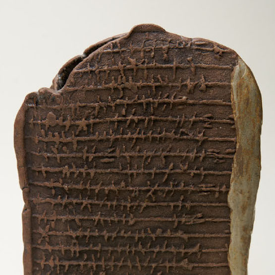 Takao Tomono, Message, 2018. Clay. 17 x 12 x 3.5” Courtesy of the artist. A sculpture of a clay tablet with elements of caligraphy.