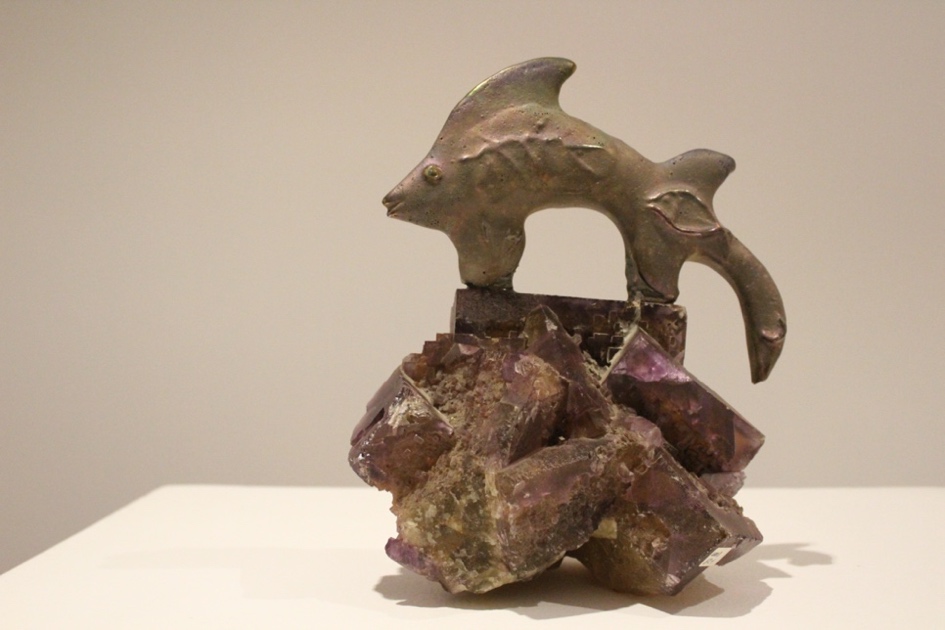 Fish Suspended over Rock made of Amethyst piece.  navigate down for further details