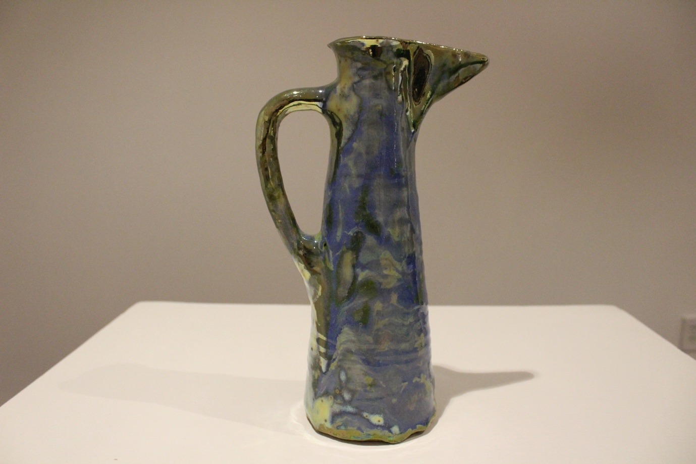 Pitcher, Cylindrical-form, with Wide Pouring Spout, Cerulean Blue-to-Greenish-Gold Glossy Surface piece.  navigate down for further details