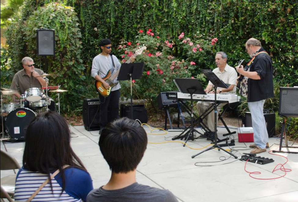 Gallery Courtyard Special Event with musical performance by friend of the galleries, Robert Grajeda, and his band in 2014.