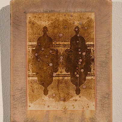 Stephen Horn, Meditation Pillow a rectangular orange/brown object.