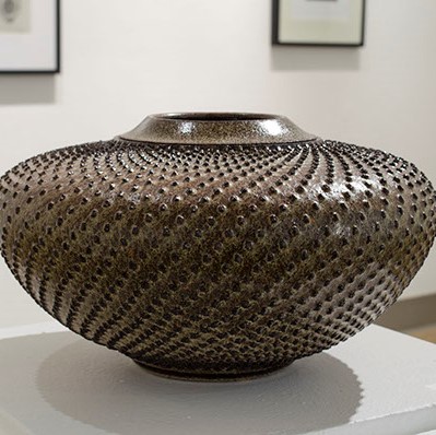Lee Middleman, "Sunflower - Winter Series" a wide vase with small black points going all around it.