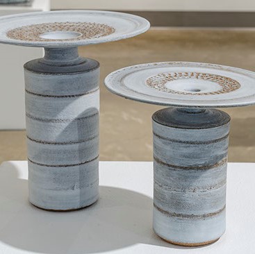 Dino Sophia, Untitled. Two pale blue cylinder-like-objects with what resembles to be a plate on top.