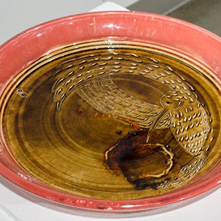 Vinent Suez, "Just a Taste" is a plate-like sculpture with a pale red ring. 