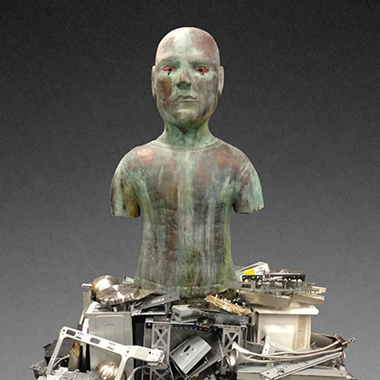 ceramic and coil-built sculpture of a person rising from a pile of disassembled computer pieces