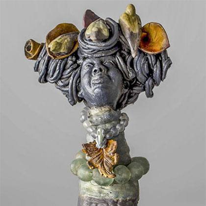hand-built with organic material slips, terra sigil-lata, rutile and copper oxide of the head of a South American lady